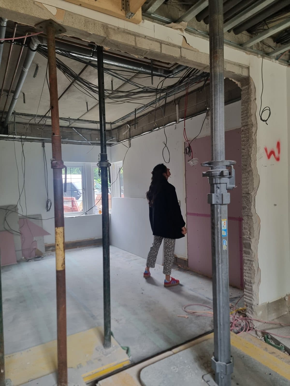 A room stripped back to bare walls during the renovation