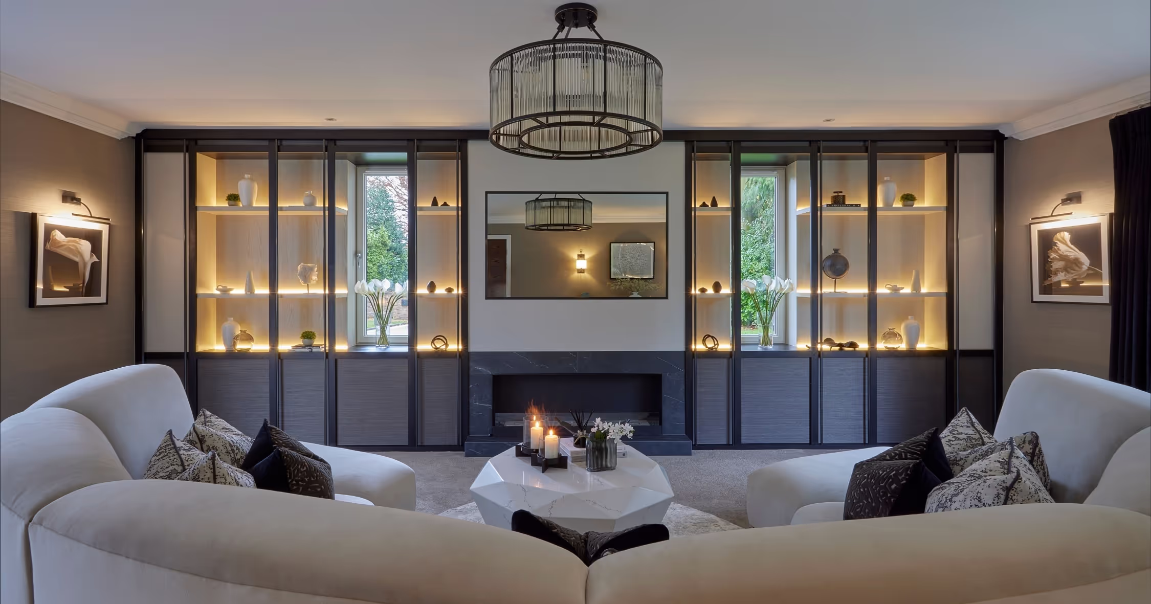 A calm Knutsford living room with backlit display cabinets, designed by Cheshire Property Studio