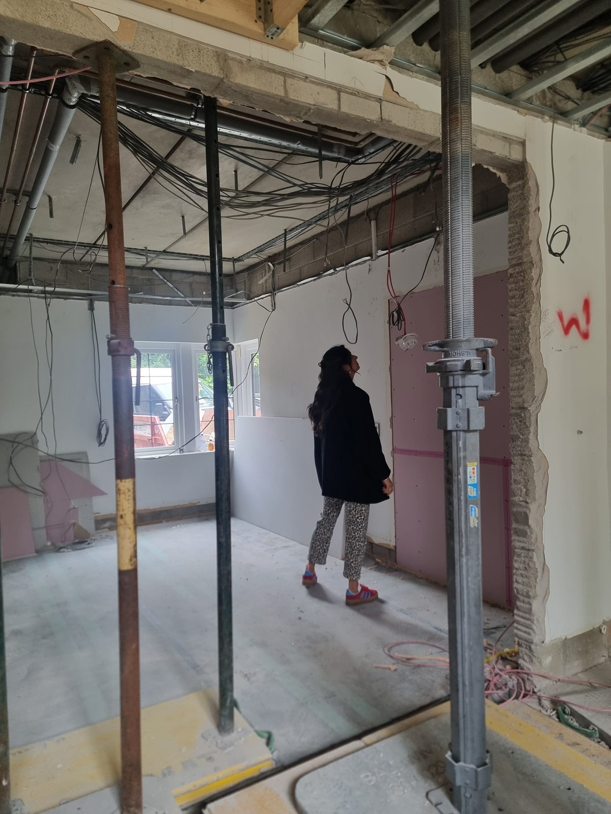 A room stripped back to bare walls during the renovation