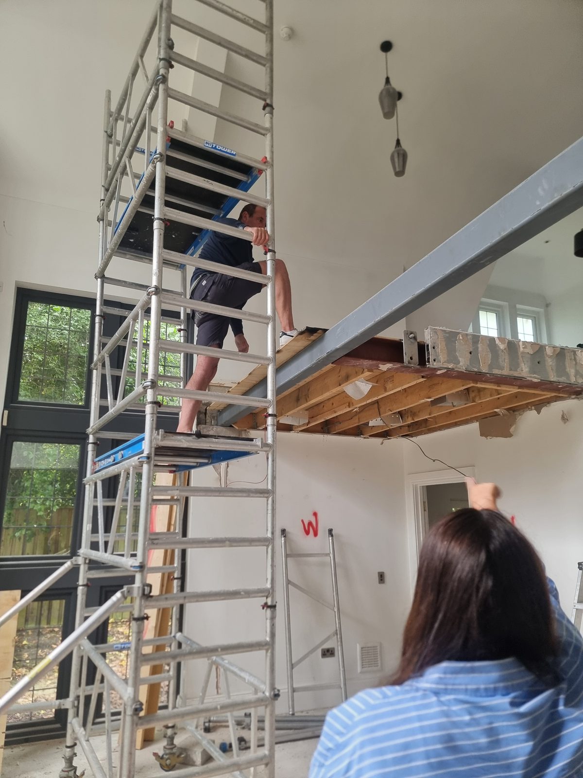 Structural work on the double-height stairwell ceiling