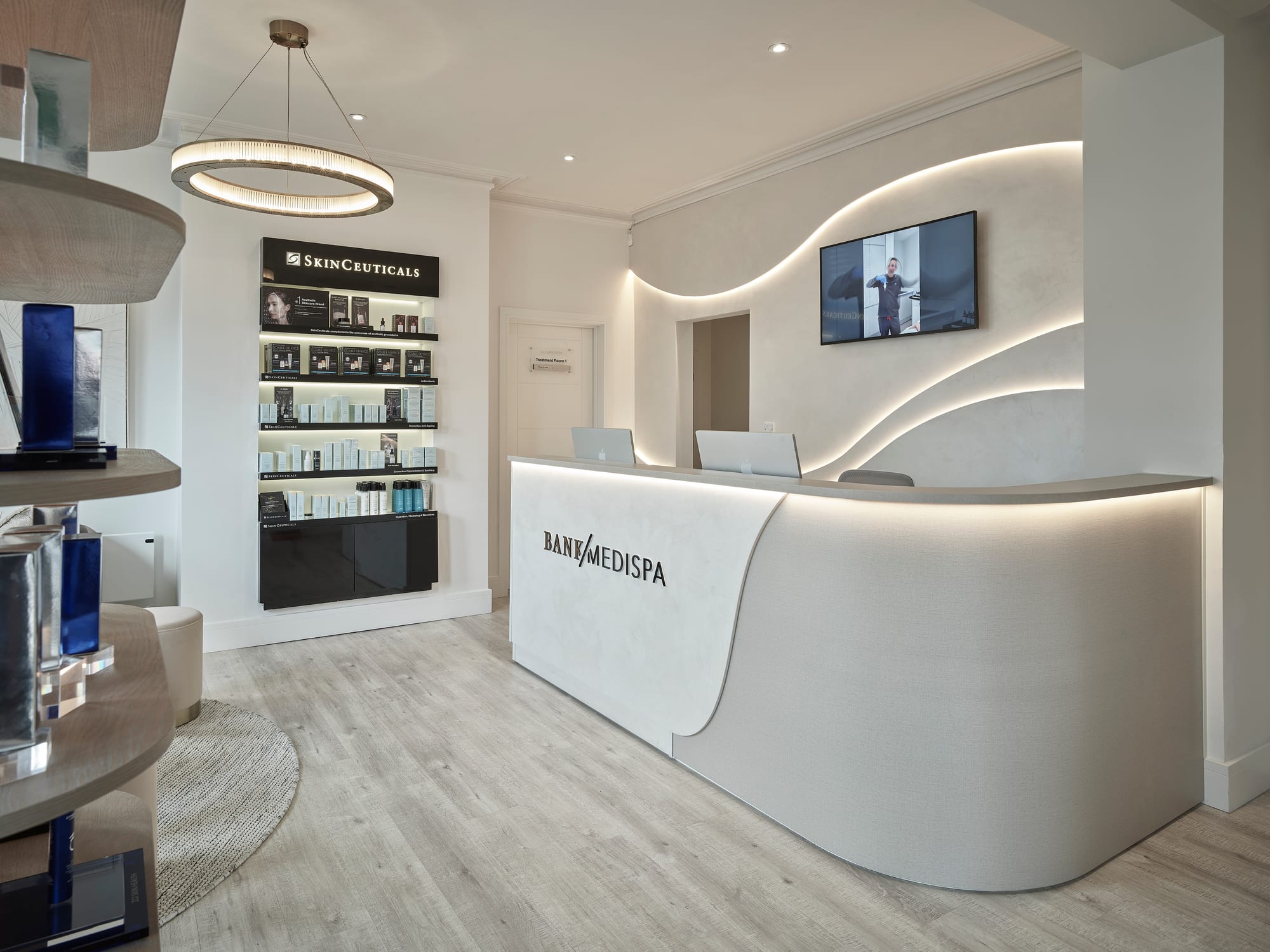 The finished backlit reception desk at Bank Medi Spa, Hale