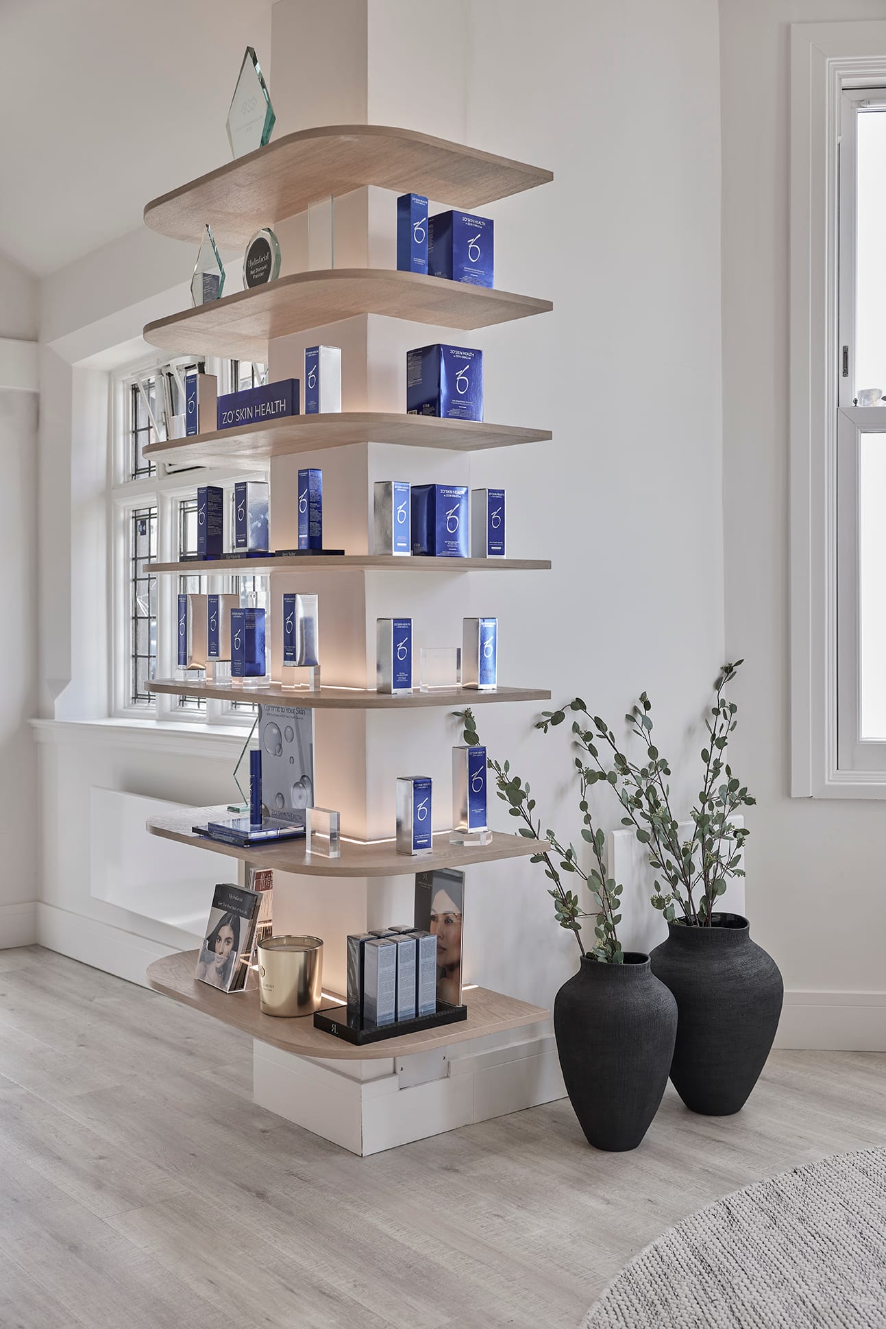 Boutique retail shelving styled with skincare products at Bank Medi Spa
