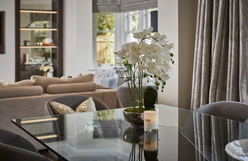 A layered living room with soft seating and natural light in a Hale Barns home