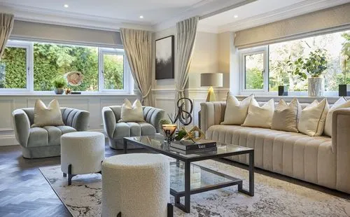 A pale, layered living room arranged around a rug