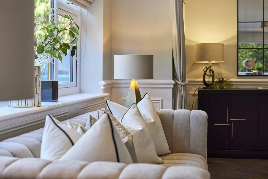 A pair of table lamps and softer, layered light make a room feel warm in the evening
