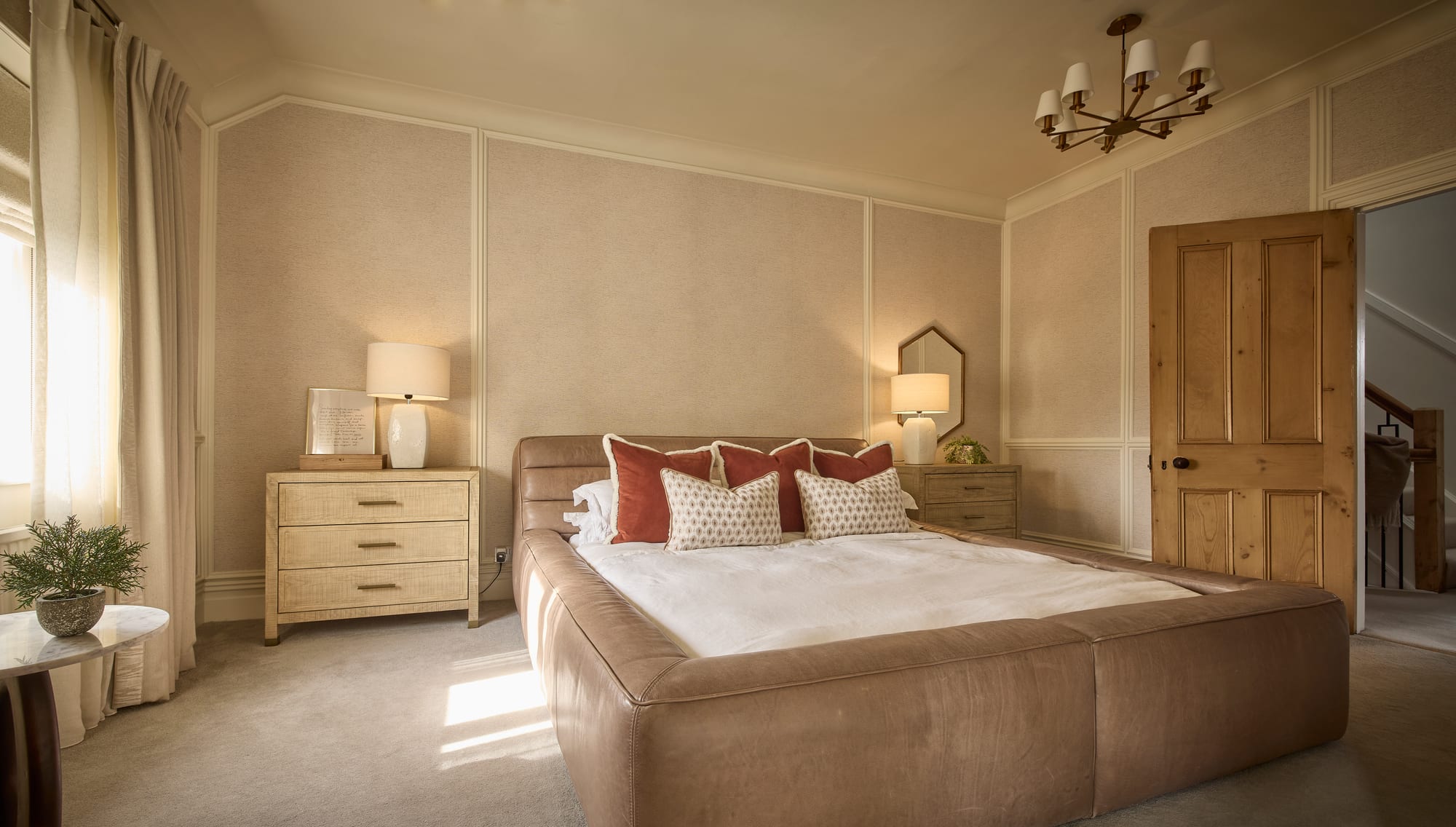 A pair of bedside lamps and softer, layered light make a room feel warm in the evening