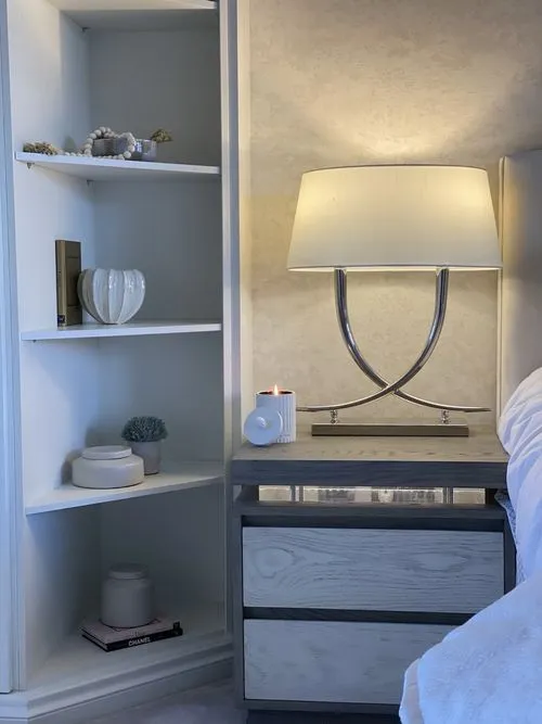 Shelving built into the alcoves, sized to the room and lit from within